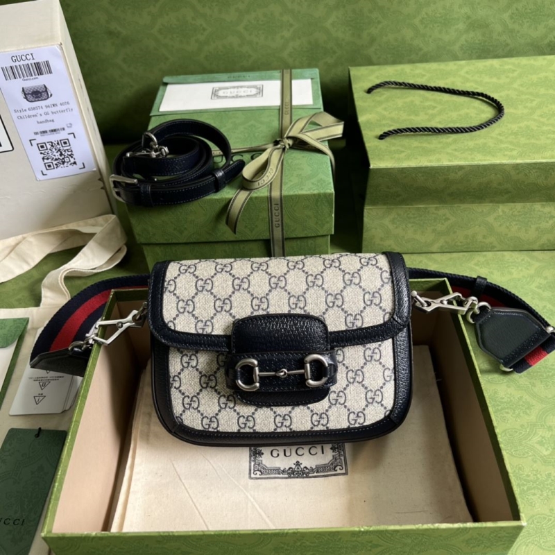 G*u*i clutch bags